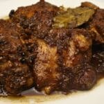 Chicken adobo in plate.