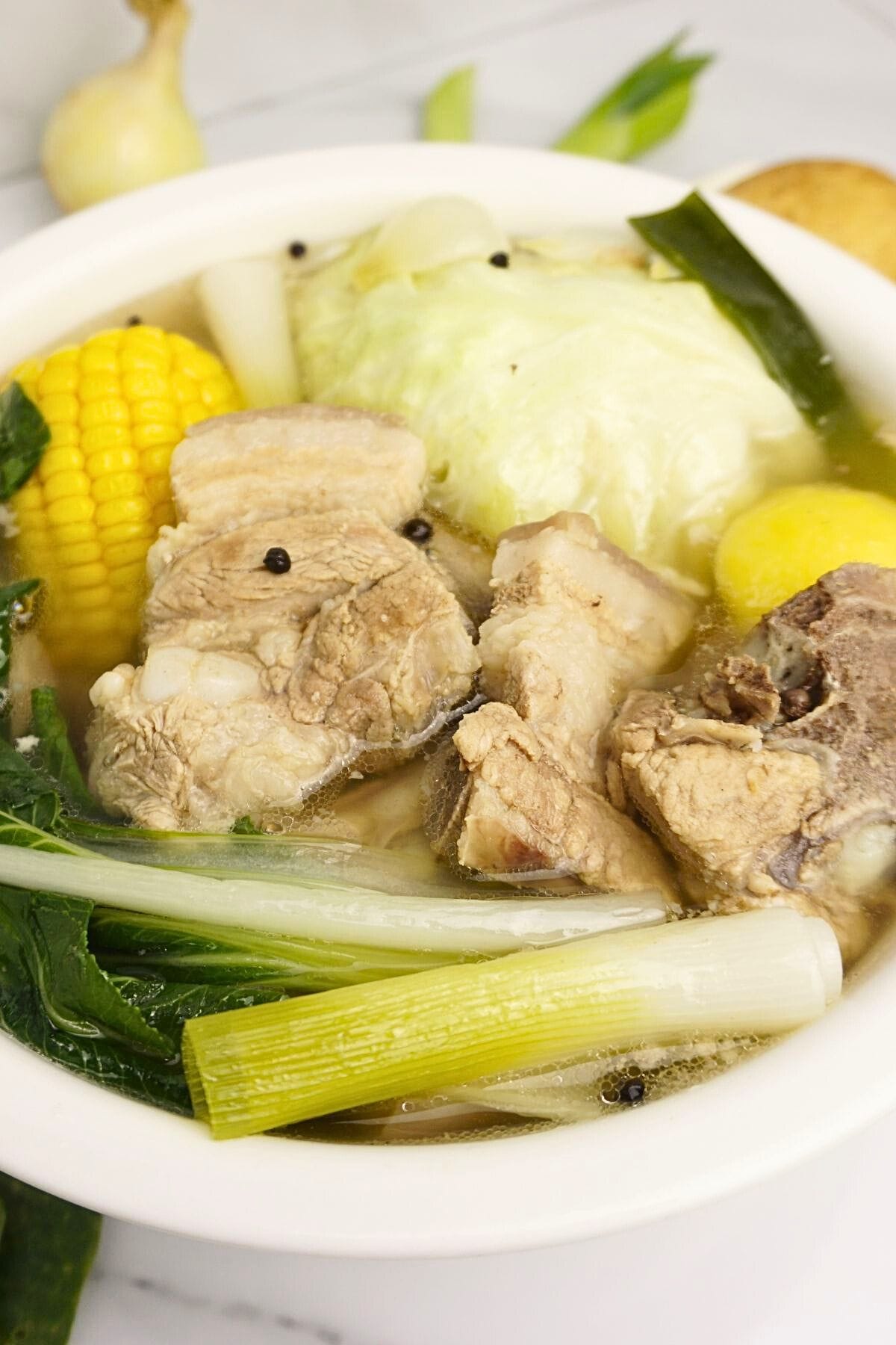 Pork nilaga with cabbage and onion leeks.