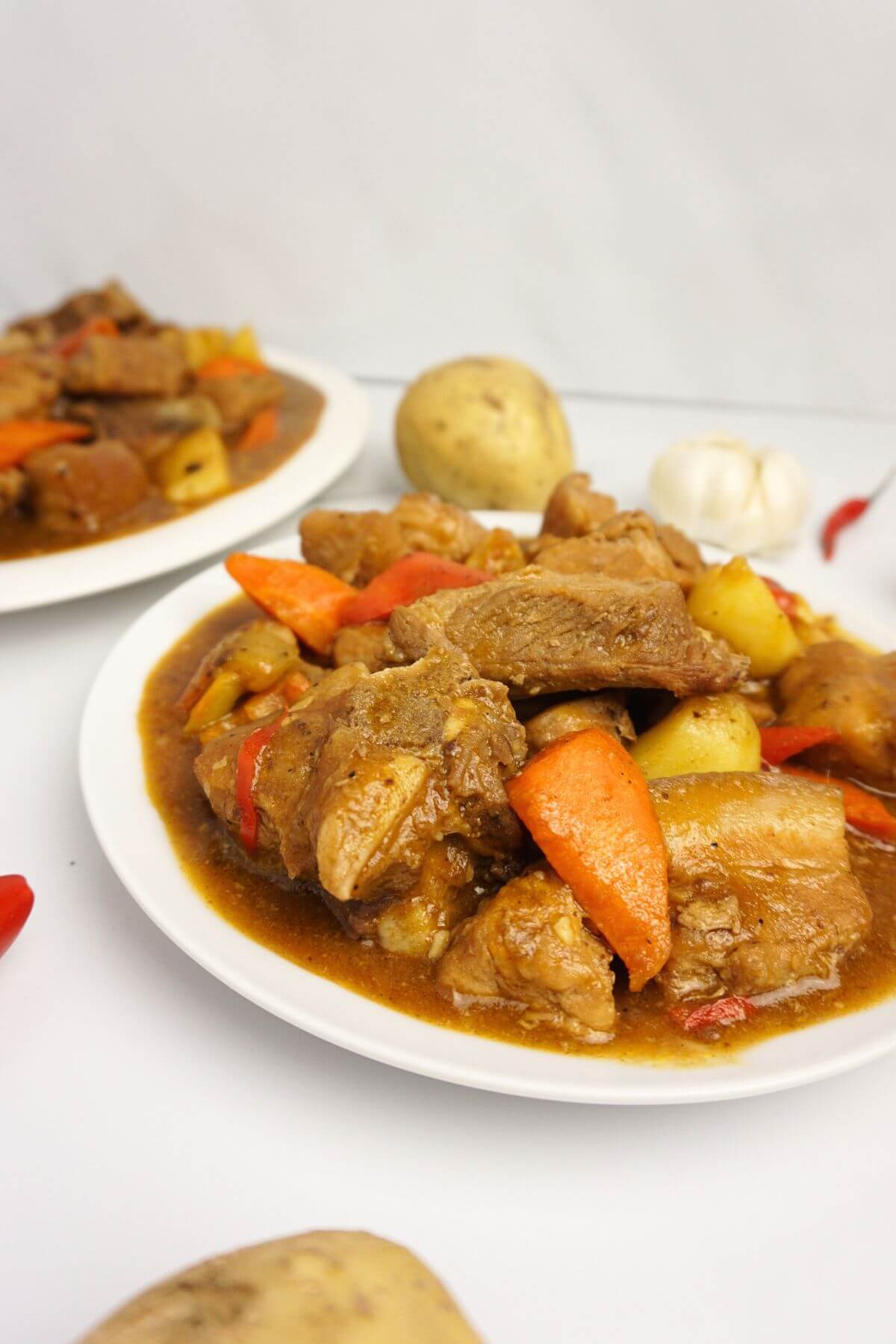 Pork caldereta in plates.