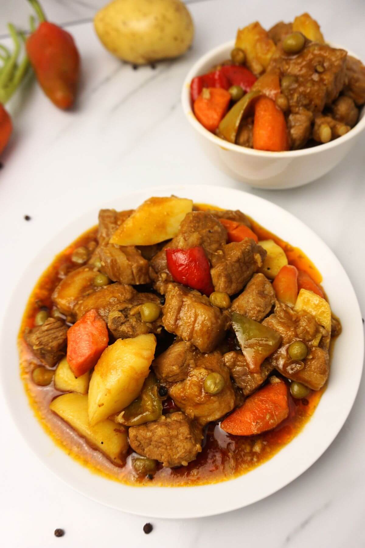 Serving of prok mechado in plate.