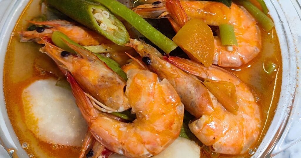 Close-up view of sinigang na hipon in bowl.