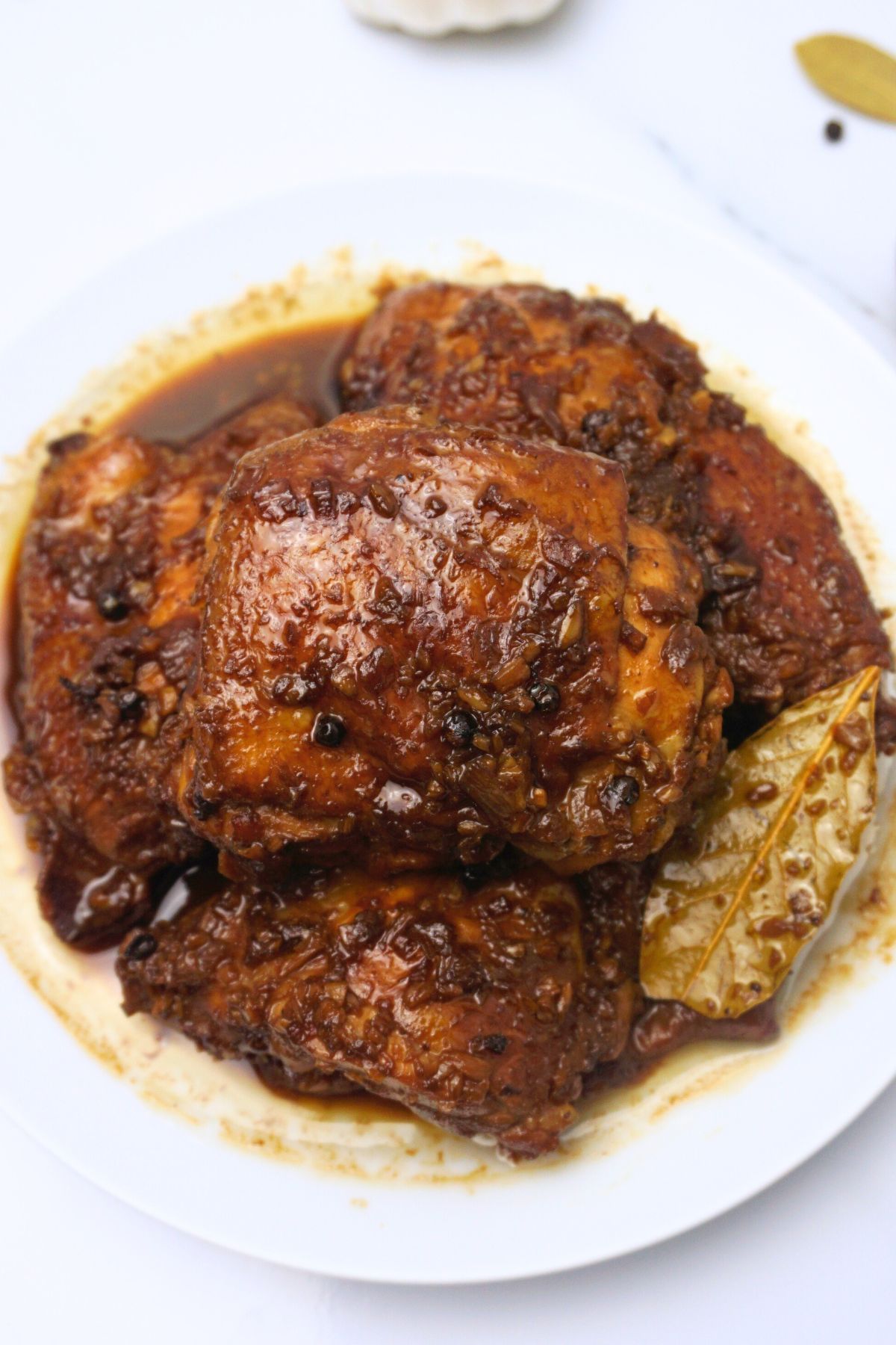 Saucy chicken adobo serving in a plate