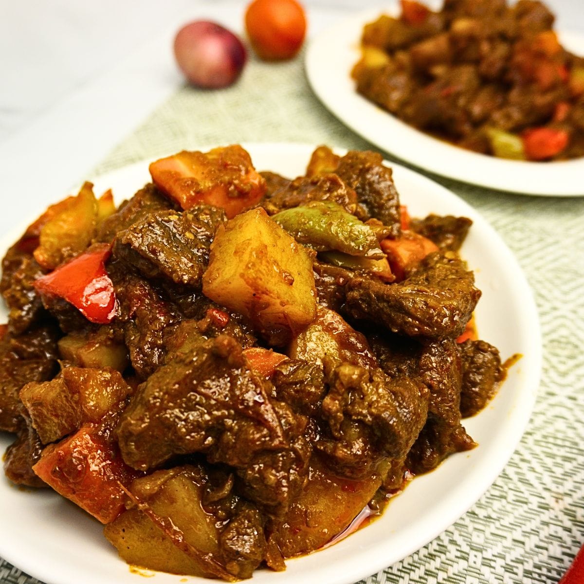 Beef stewed in tomato sauce shot in close-up.