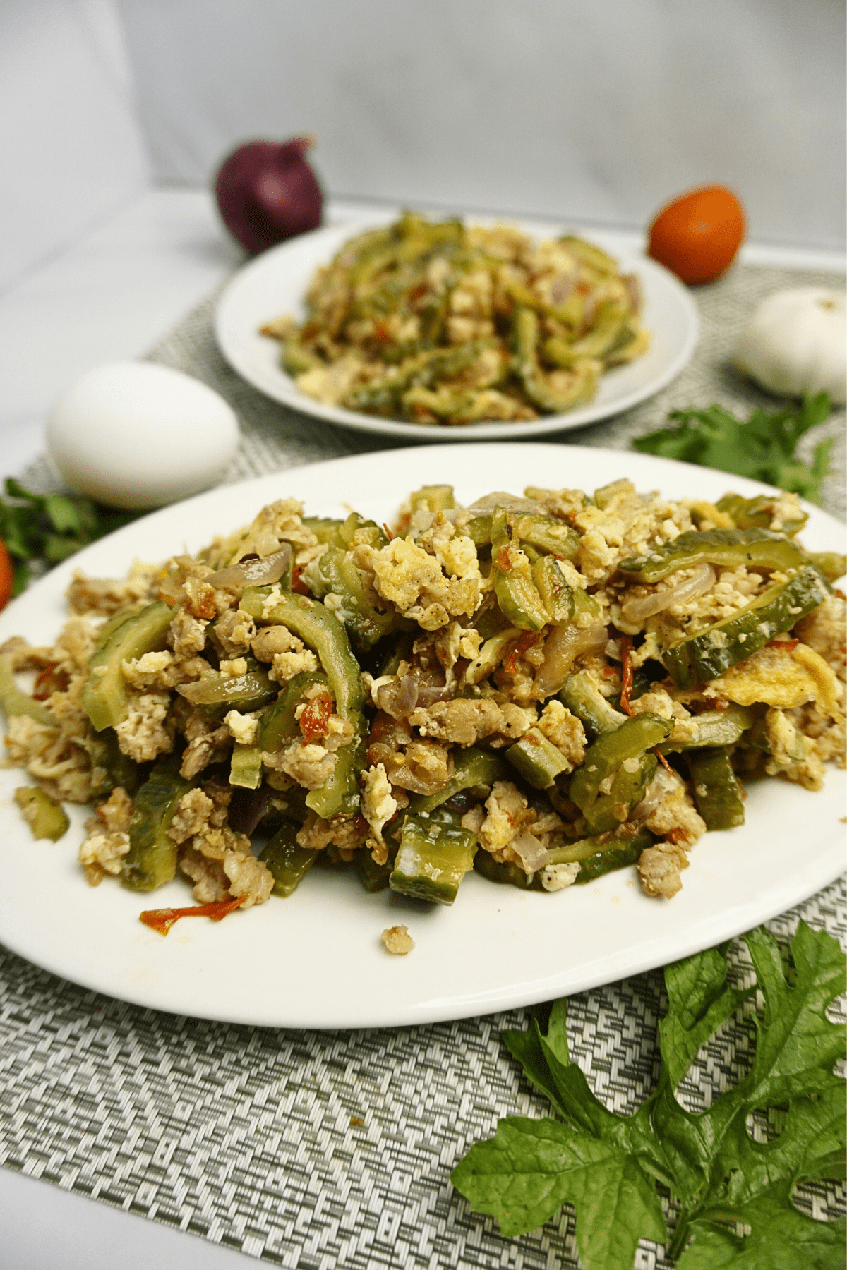 Ginisang ampalaya with tomatoes, egg and ground pork.