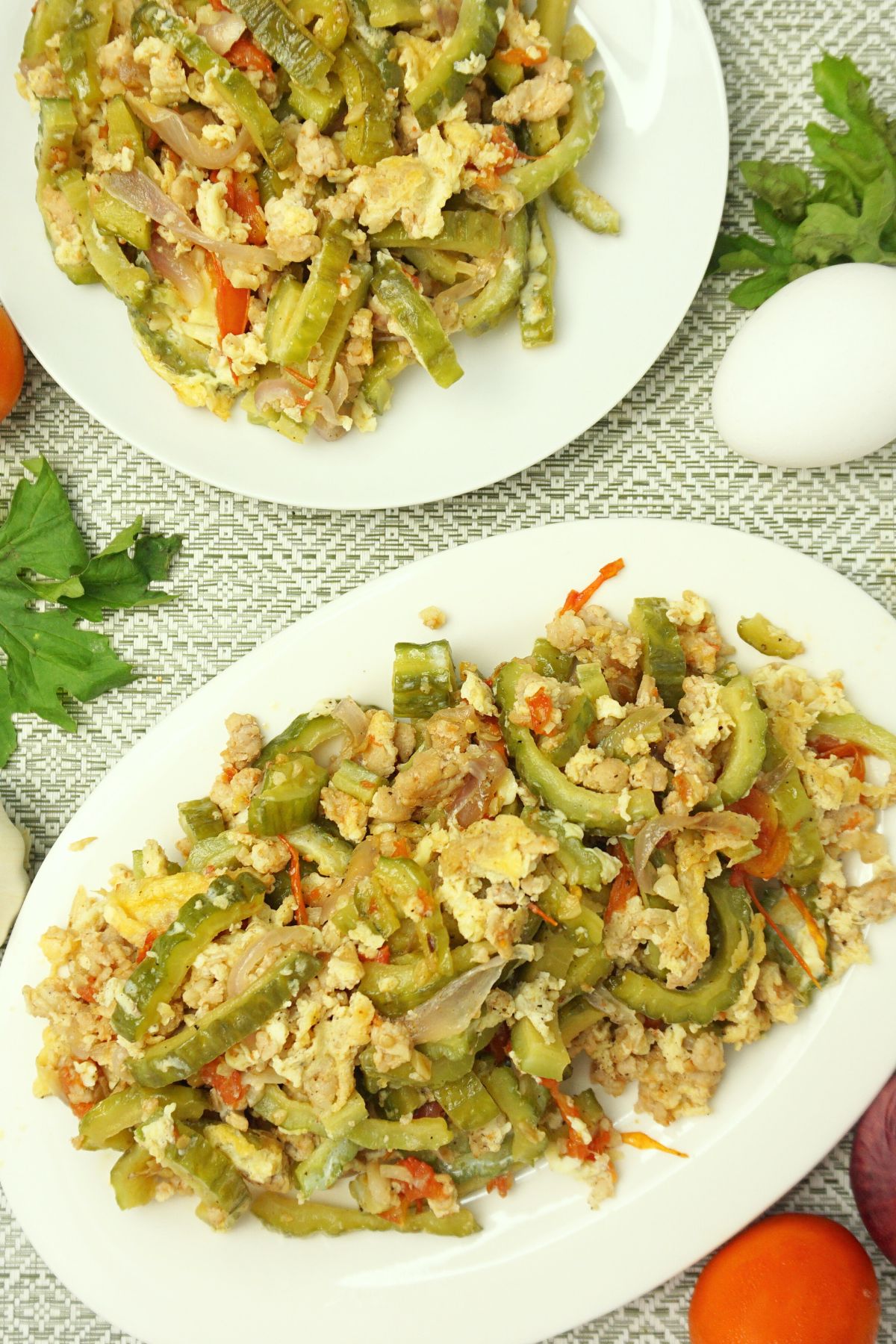 Serving of ampalaya with egg in plates