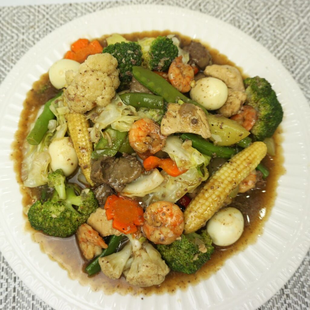Vegetable chopseuy served in a white dish