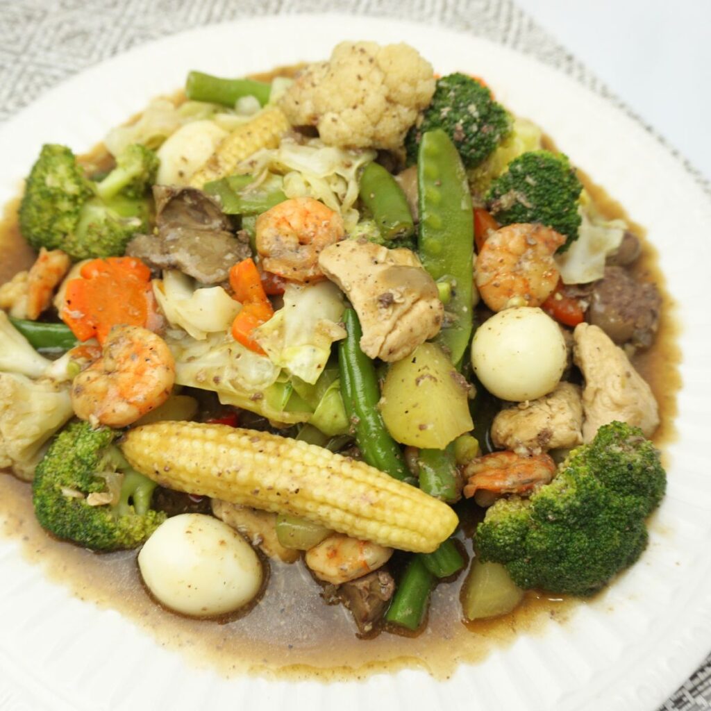 Rich and colorful chopseuy served in a white plate