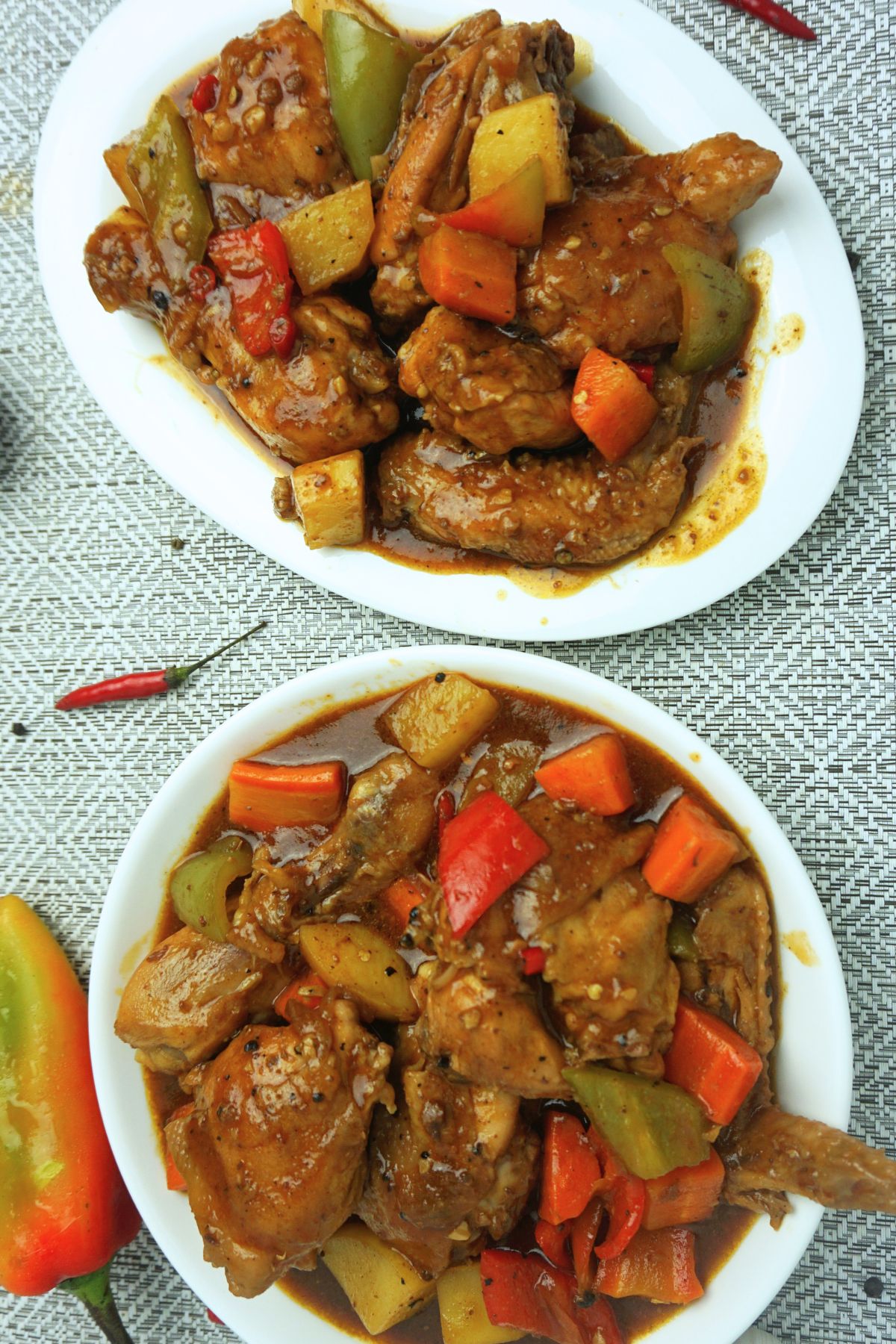 Chicken Caldereta servings in bowl and plate