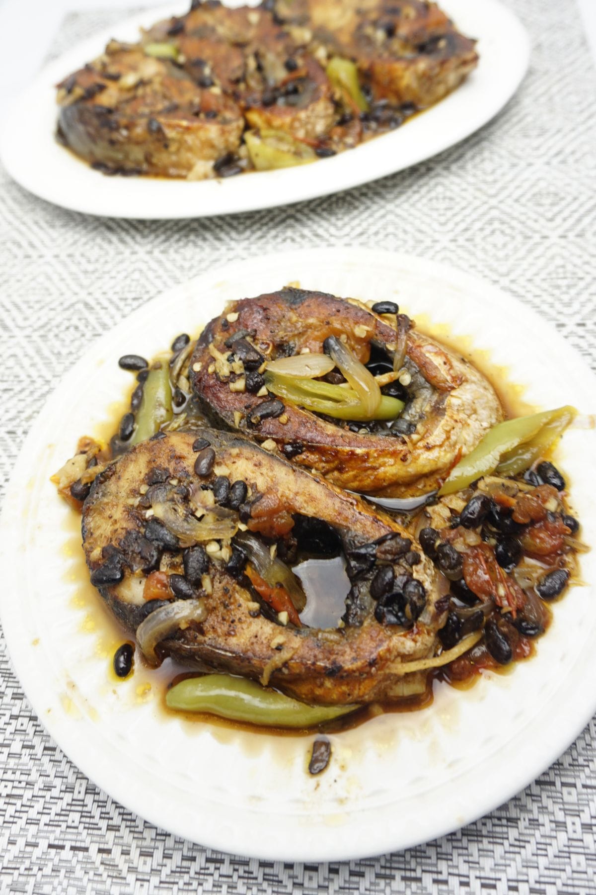 Bangus belly with tausi in plates.