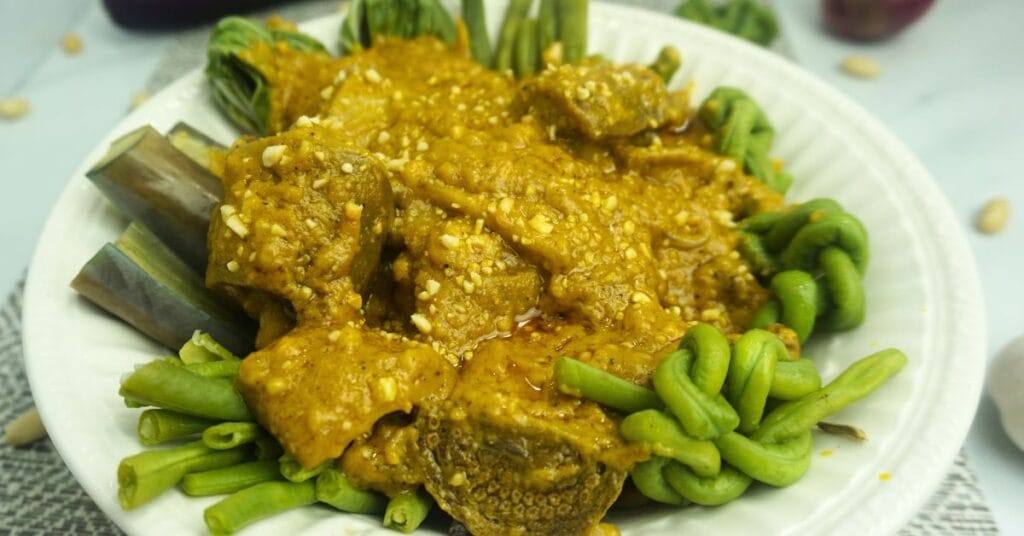 Beef kare kare in plate.