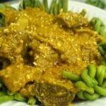 Beef kare kare in plate.