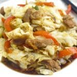 Ginisang repolyo in a plate with chopsticks.