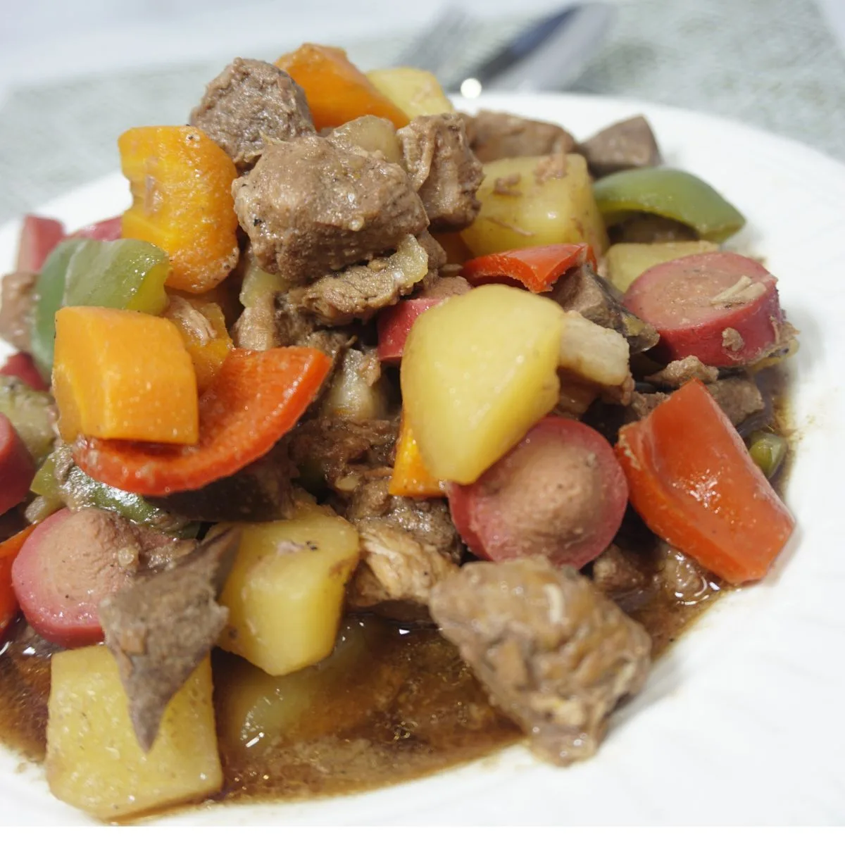 Pork menudo with carrots, potatoes and bell peppers.