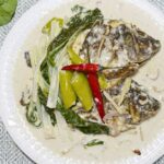 Ginataang tilapia in a plate.