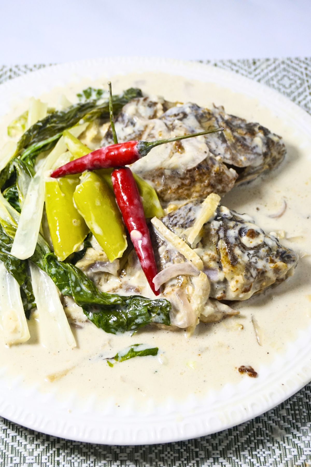 Tilapia in coconut cream serve with chilies.