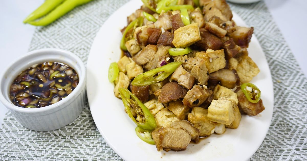 Crispy tokwa't baboy with vinegar and soy sauce dipping.