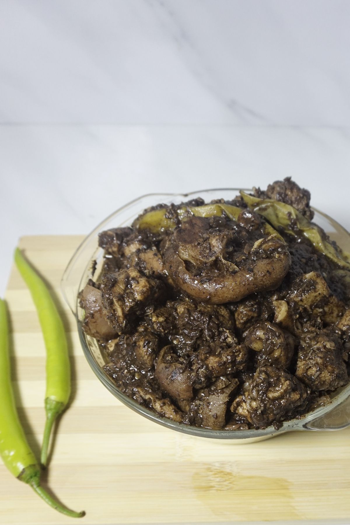Pork dnuguan served in a glass bowl
