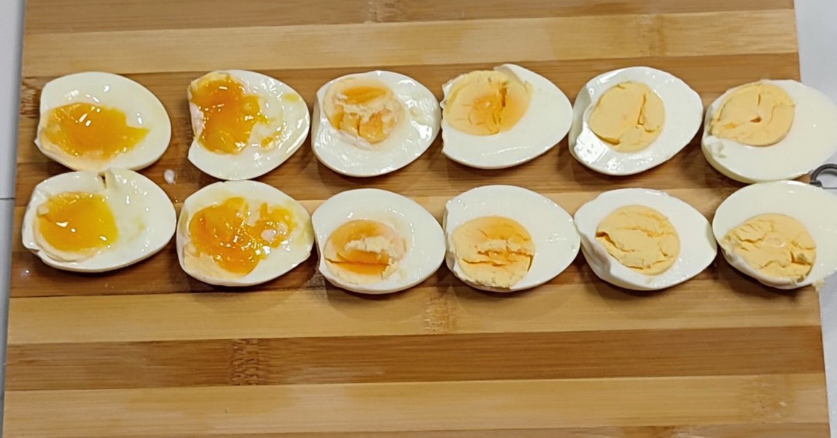 Boiled eggs in a wooden board.