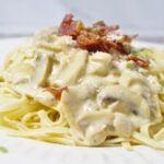 White sauce pasta with bacon, ham, mushroom, cream of mushroom, evaporated milk and all-purpose cream.