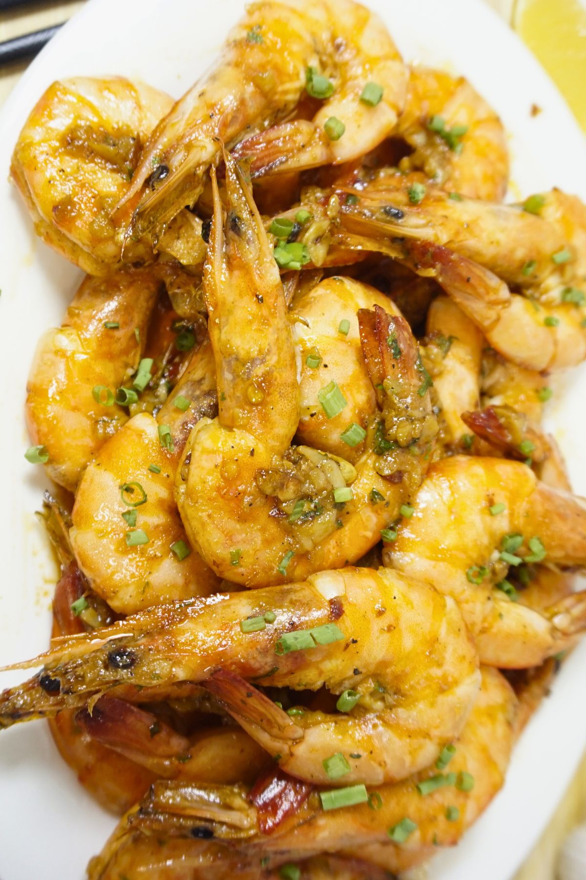 Shrimps sauteed in butter and garlic garnished with parsley.