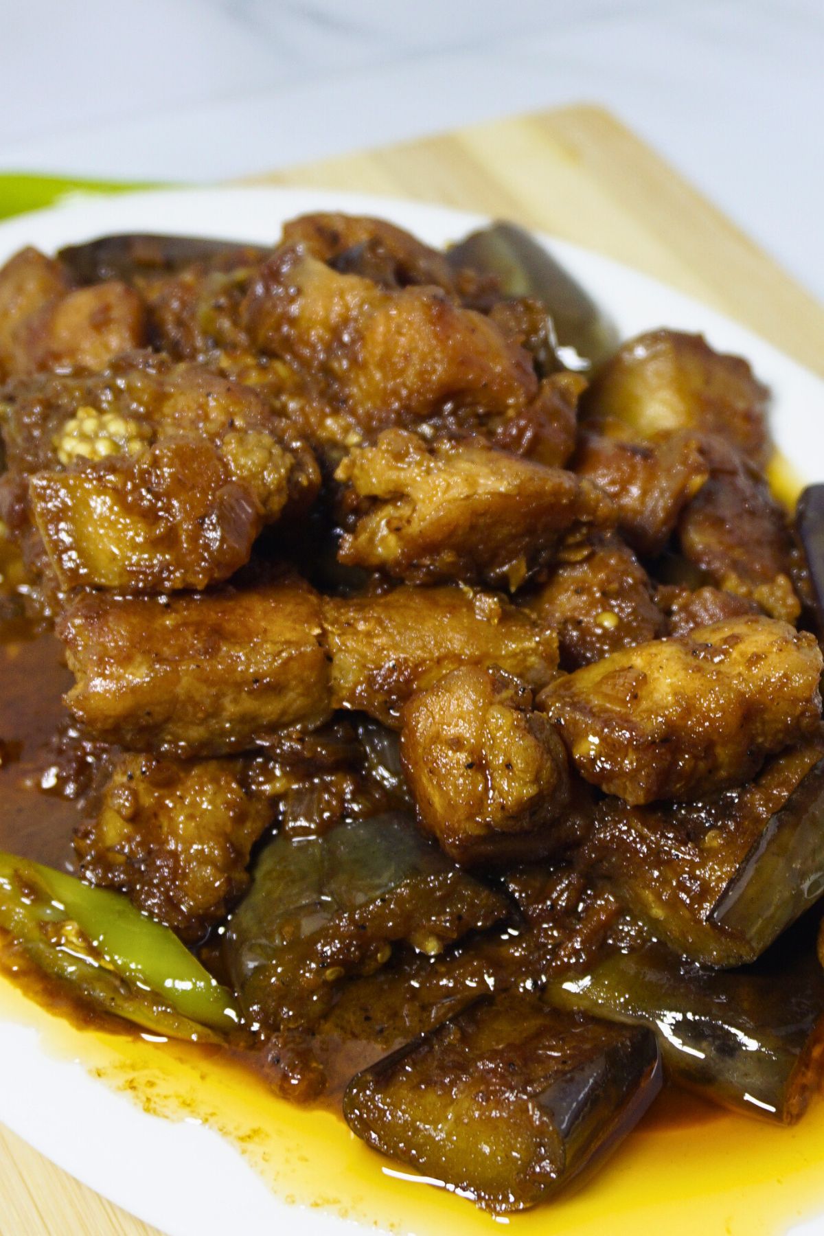 Pork binagoongan with green chilies and fried eggplant.