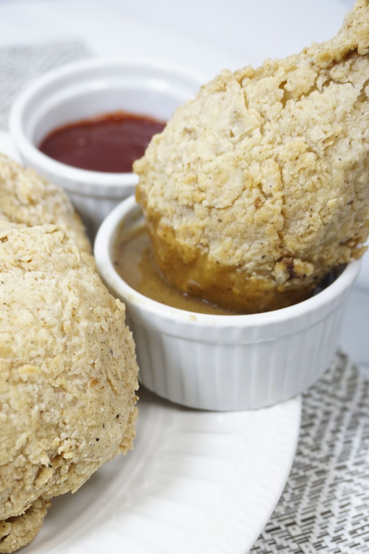 Fried chicken dipped in gravy
