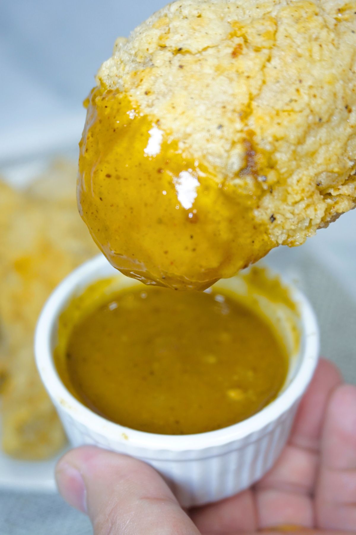 Fried chicken dipped in a gravy