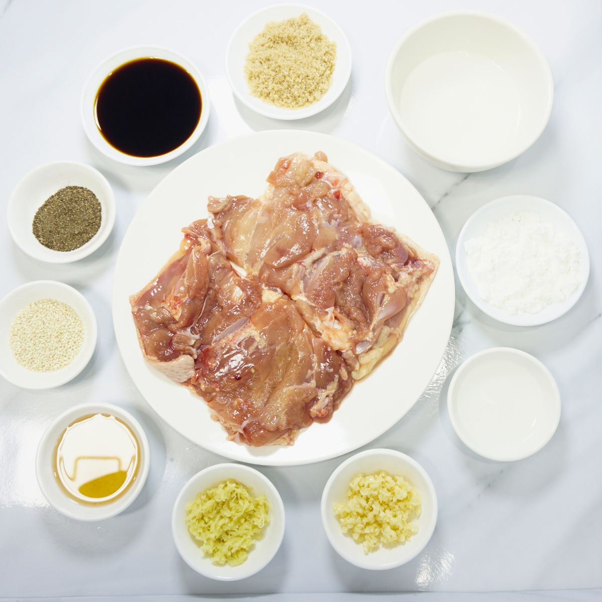 Chicken teriyaki ingredients. Boneless chicken thigh, honey, sugar, soy sauce, garlic, ginger, cooking oil, vinegar, water and cornstarch.