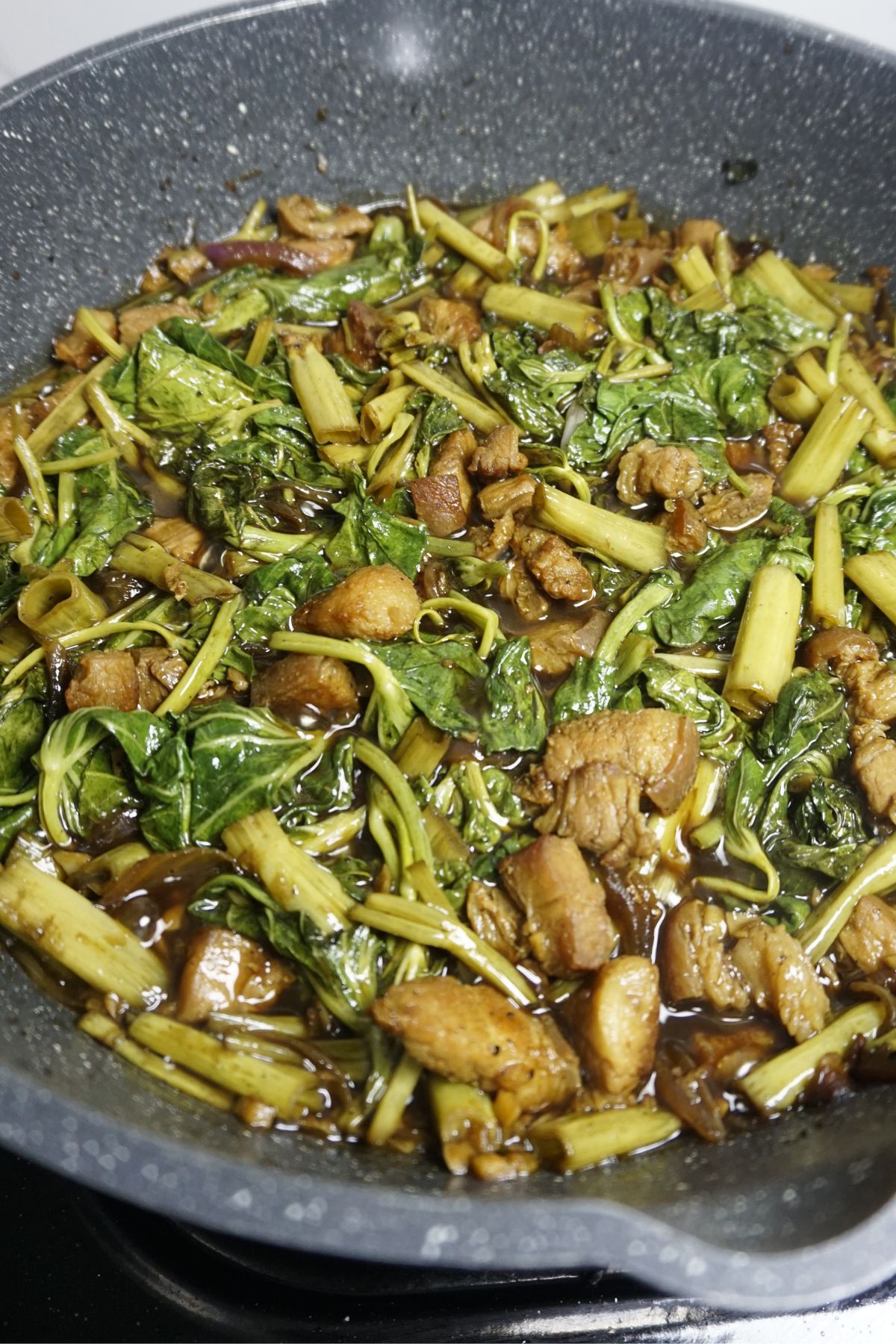 Adobong kangkong in a pan
