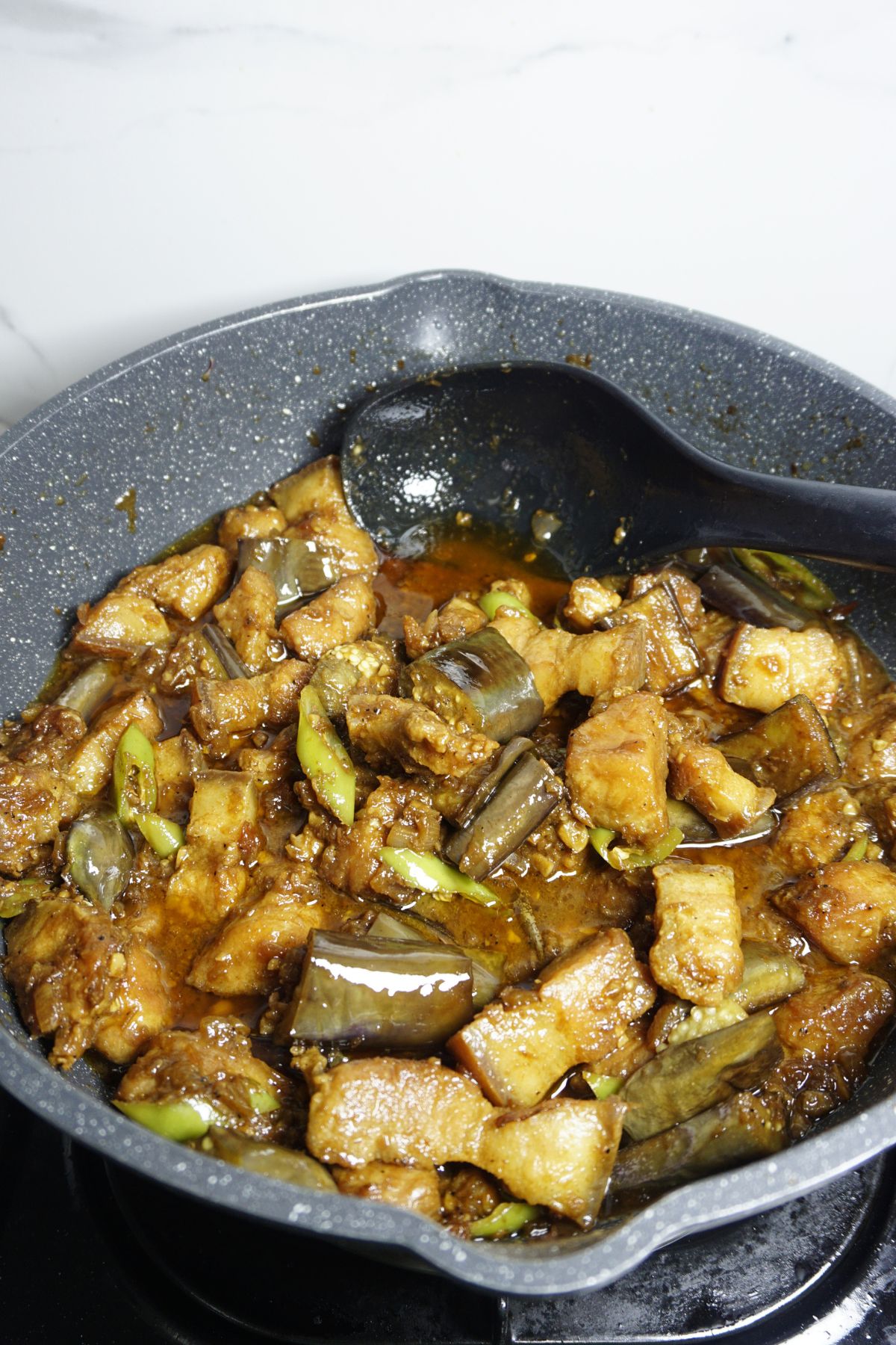 Pork binagoongan in a pan.