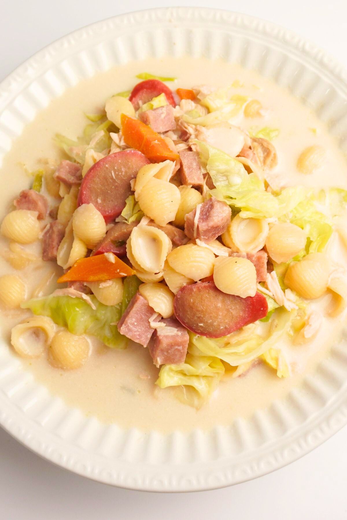 Serving of chicken sopas in a white bowl