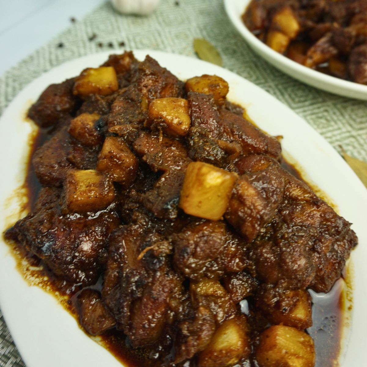 Pork Hamonado in oval plate with pineapples