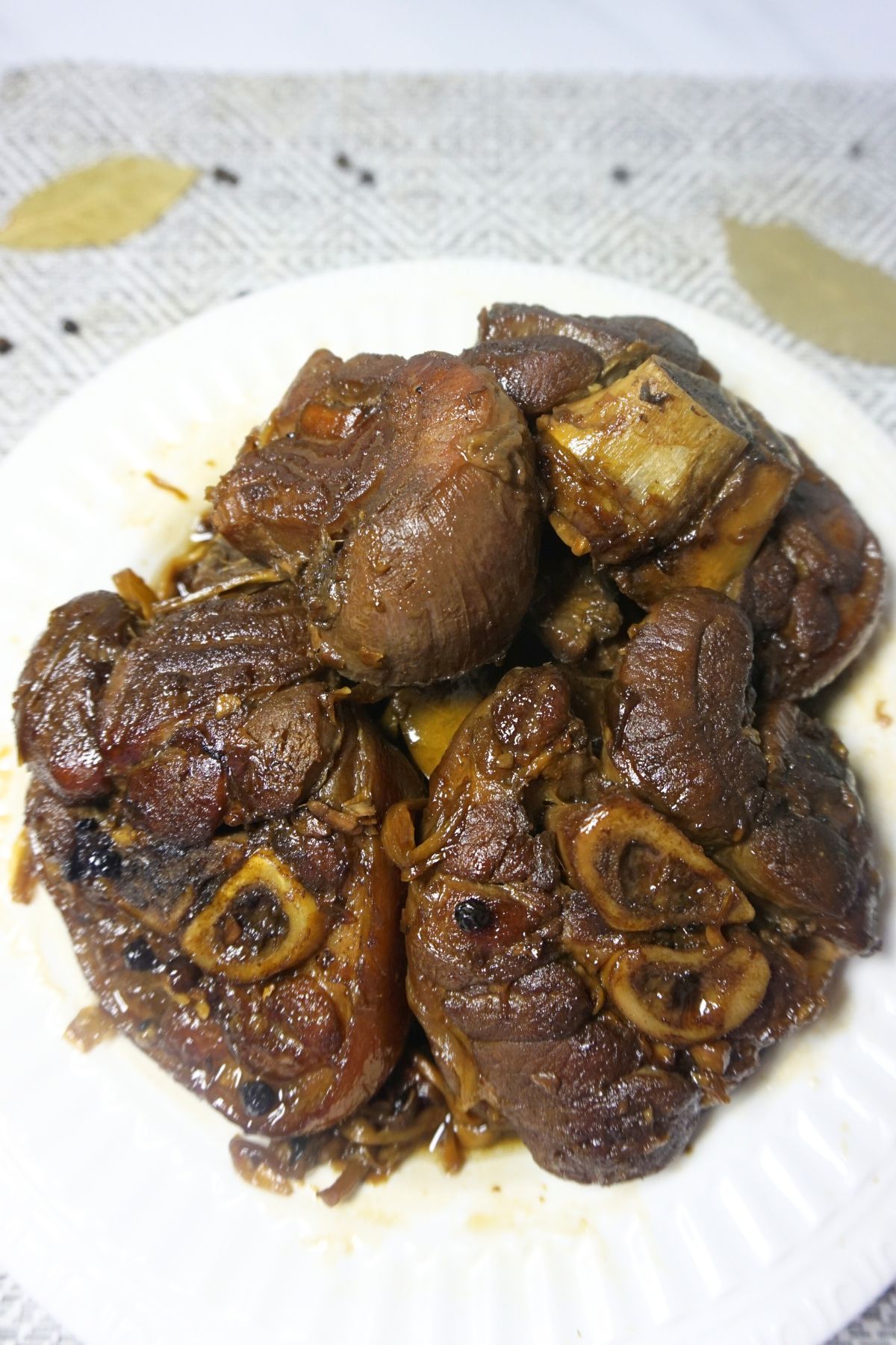 Paksiw na pata served in a white plate.