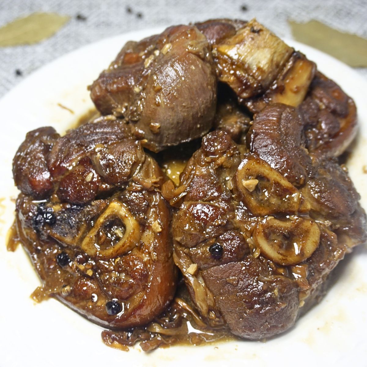 Paksiw na pata serving in a white plate.