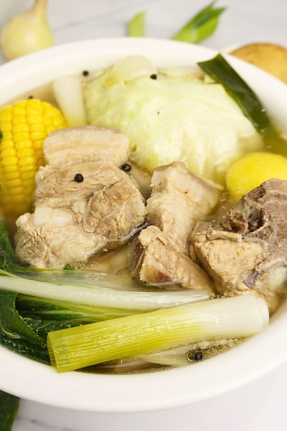 Comforting pork nilaga served in a white bowl.