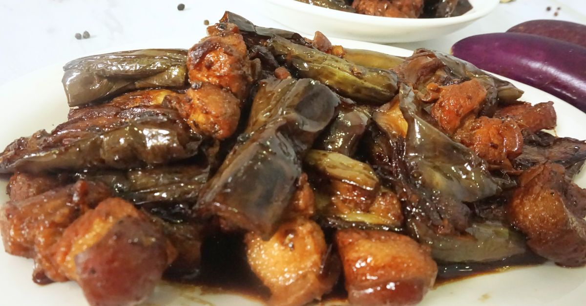 A plateful serving of savory eggplant adobo with pork.