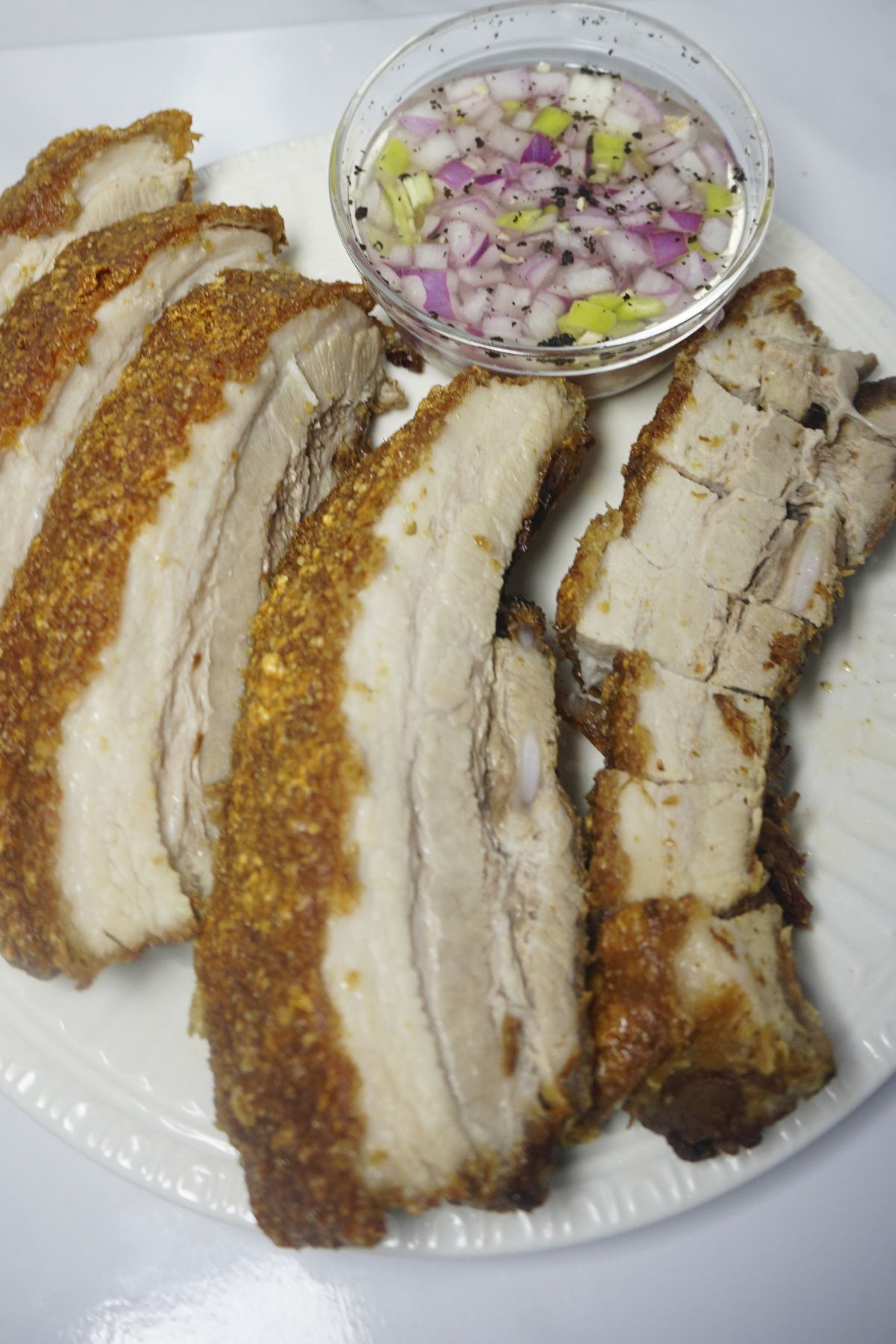 Sliced lechon kawali with vinegar dip