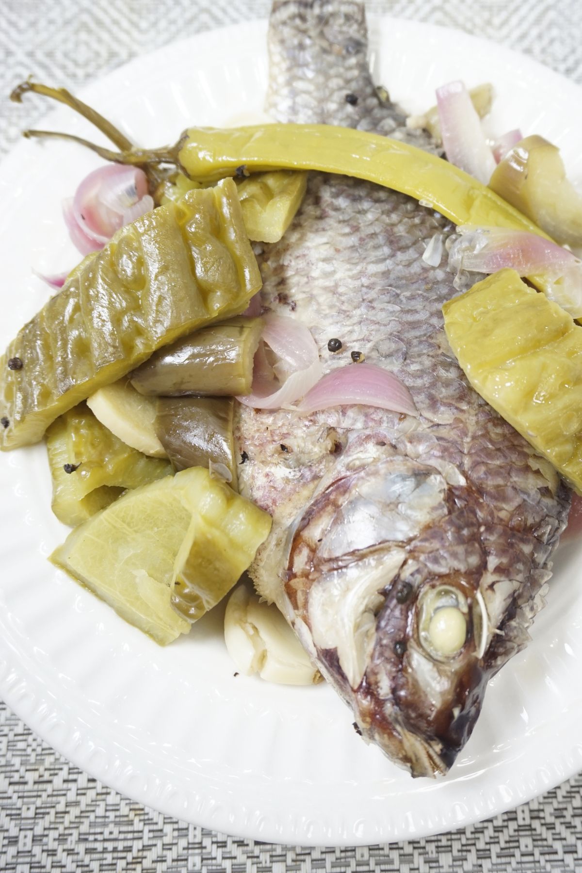 Paksiw na tilapia with eggplant and bittermelon.