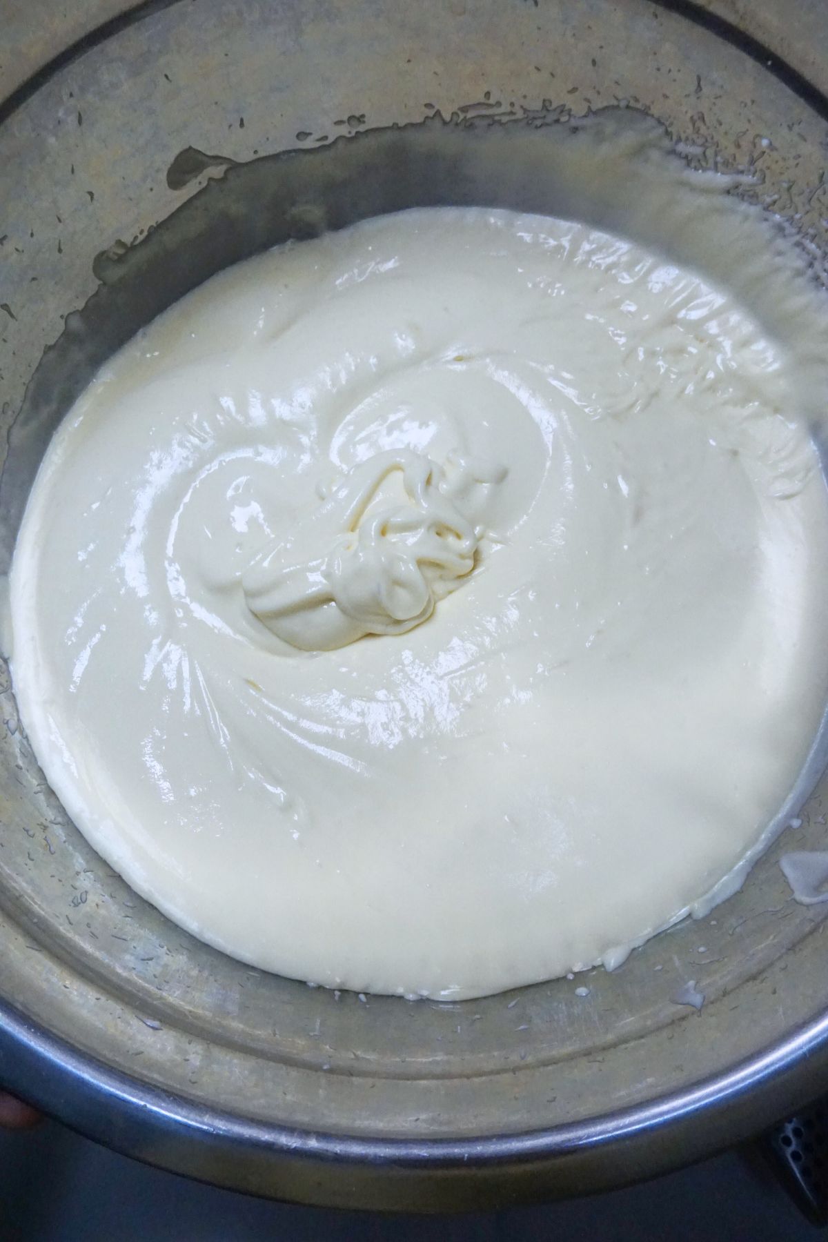 Whipped chilled cream in a metal bowl