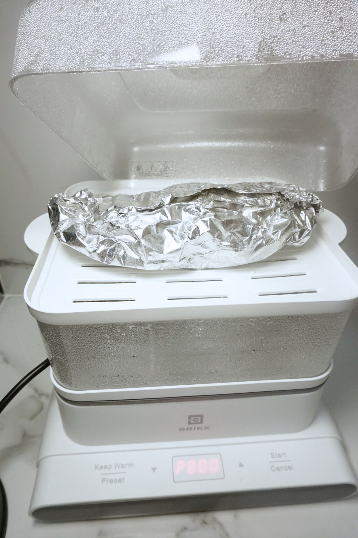 Wrapped stuffed tilapia in a steamer