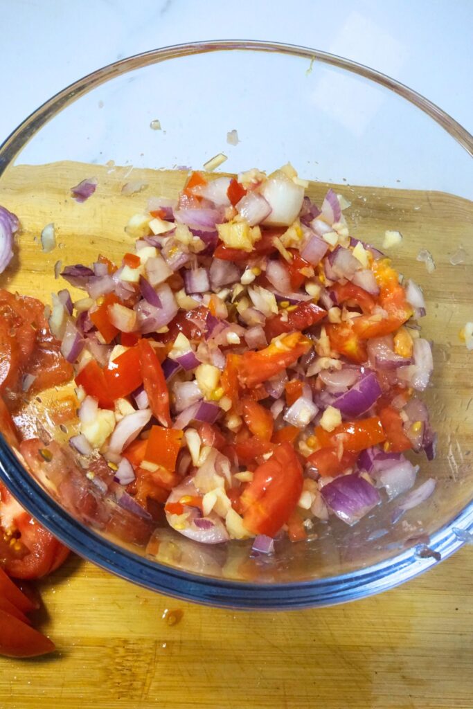 Seasoned tilapia stuffing in a glass bowl