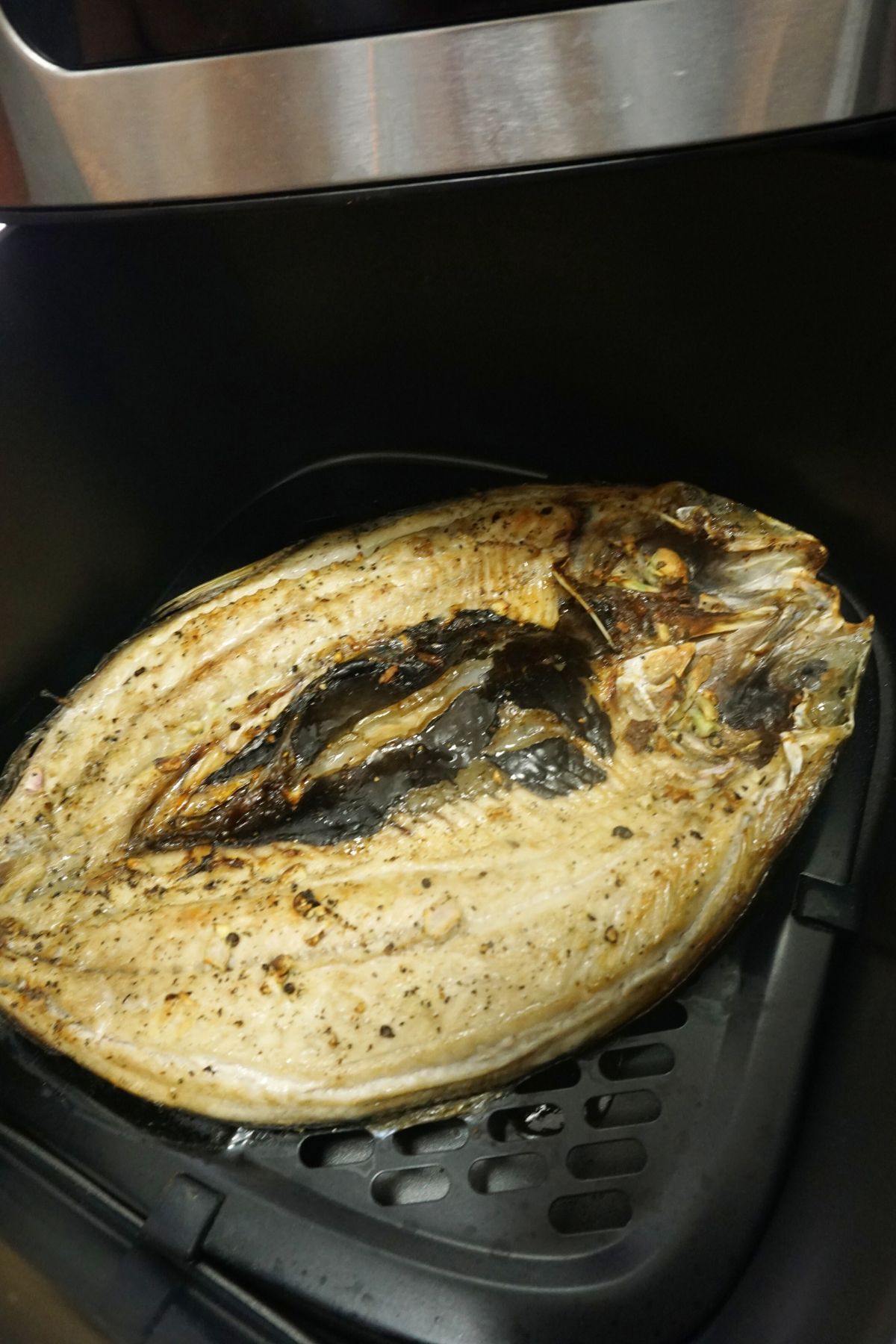 Air fryer bangus inside an air fryer basket