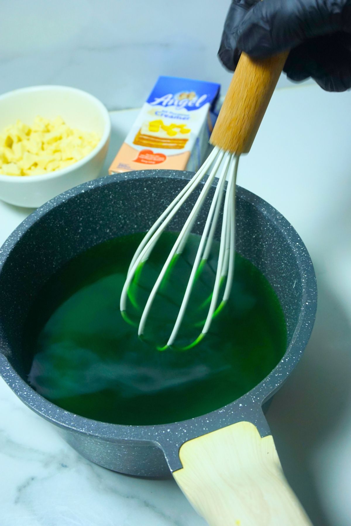 Whisking gulaman powder mix in pot