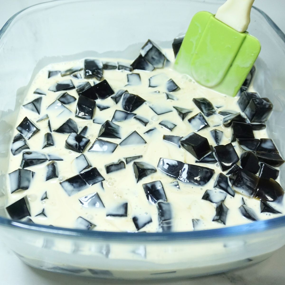 Coffee jelly salad dessert mixture in a glass dish
