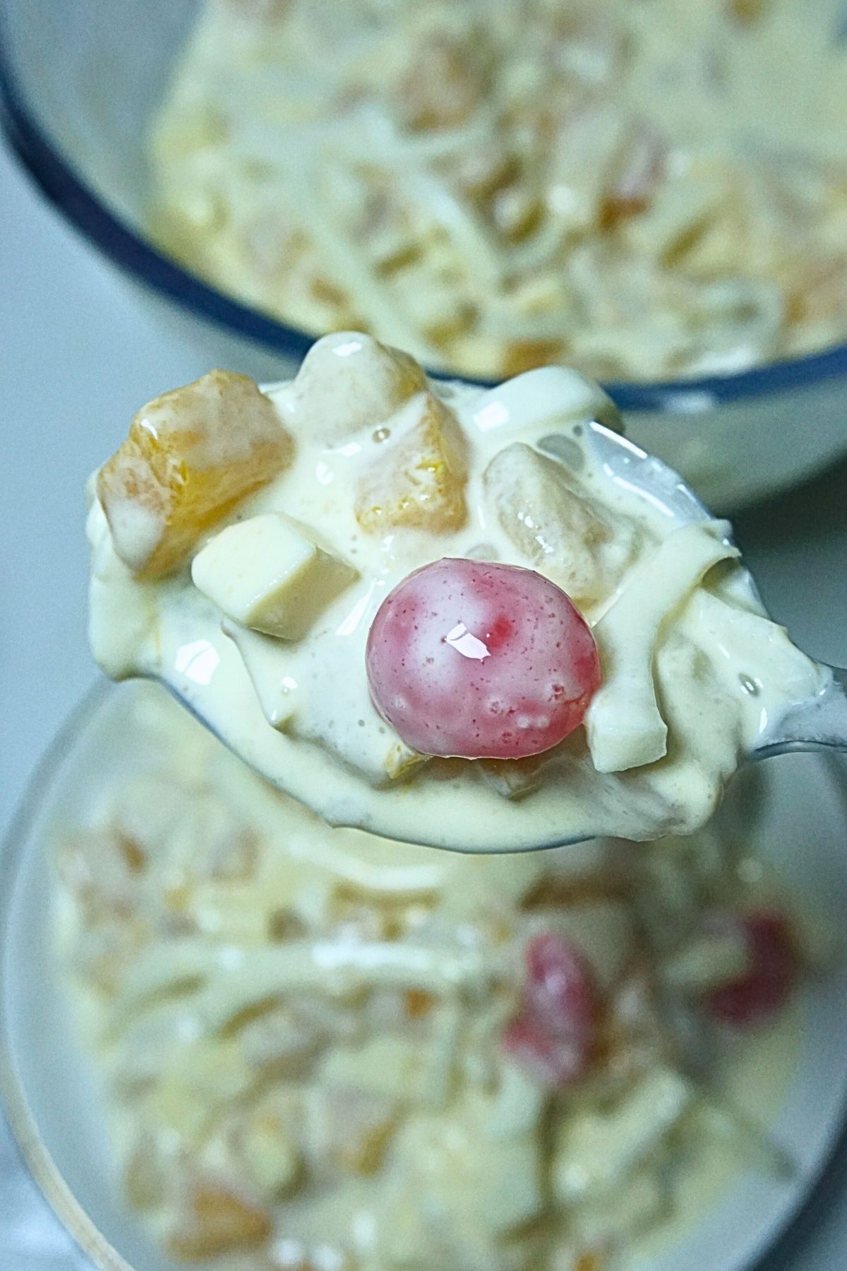 Spoonful of creamy cocktail salad