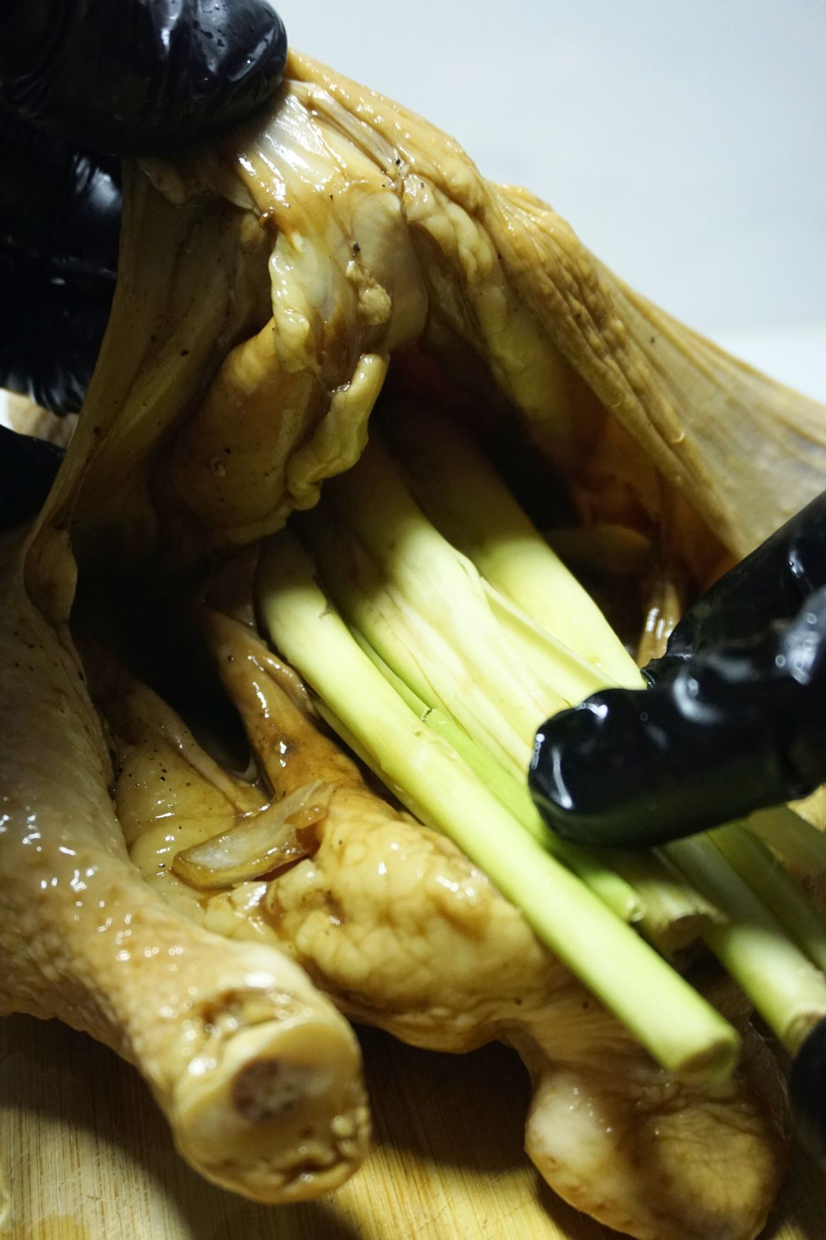 Whole marinated chicken stuffed with spices