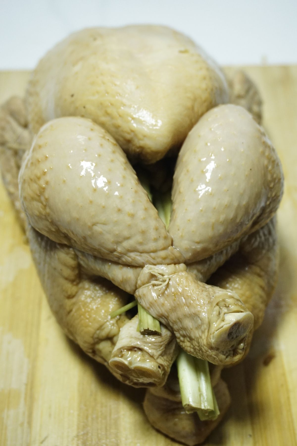 Whole stuffed chicken tied with a kitchen twine