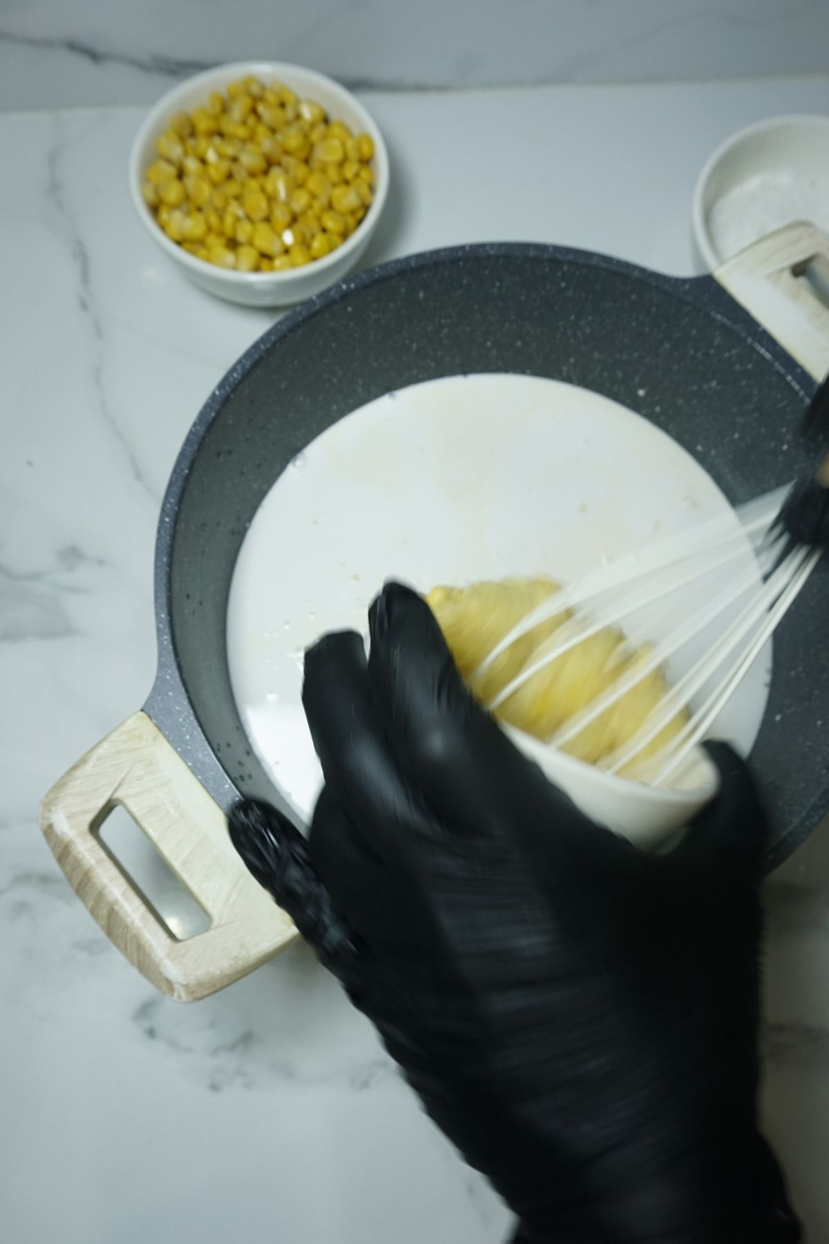 Cream corn added to maja blanca mixture