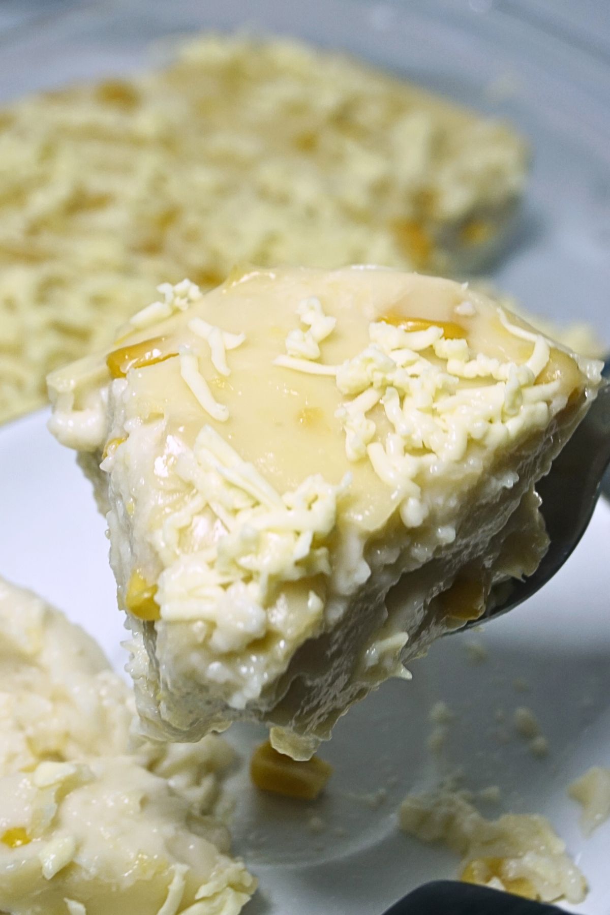 Spatula lifting a slice of maja blanca