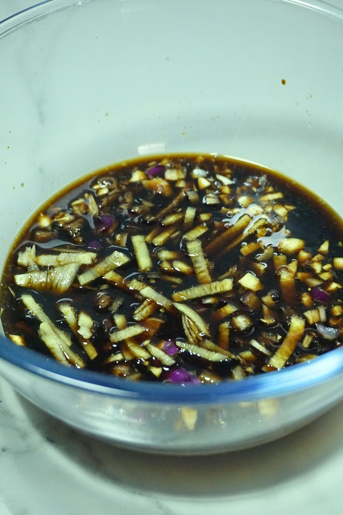Lechon manok marinade in a bowl